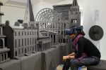 A woman in a VR headset looking at an architectural model