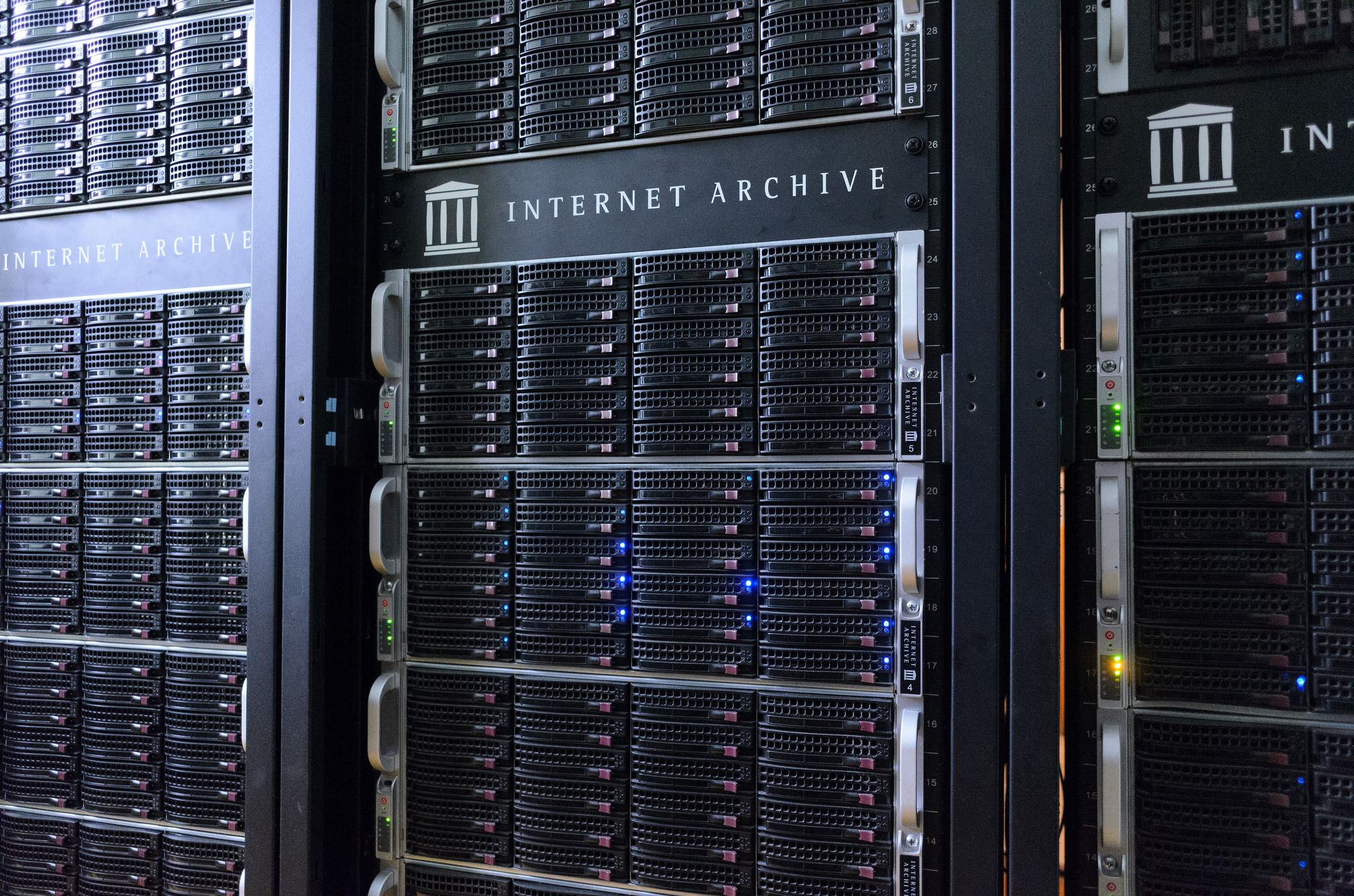 Racks of servers with the Internet Archive logo on them